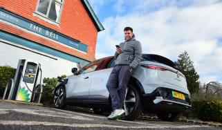 Steve Walker charging Renault Megane E-Tech outside pub
